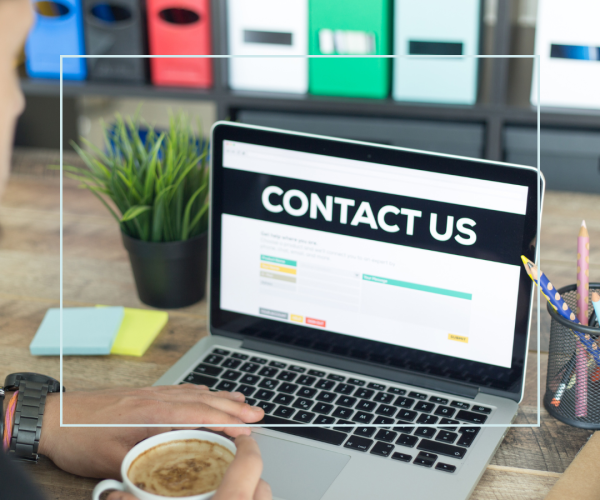 Image of a laptop with the words 'contact us' on it